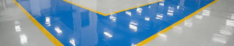 A factory floor professionally covered and marked with epoxy flooring in Rockford, IL