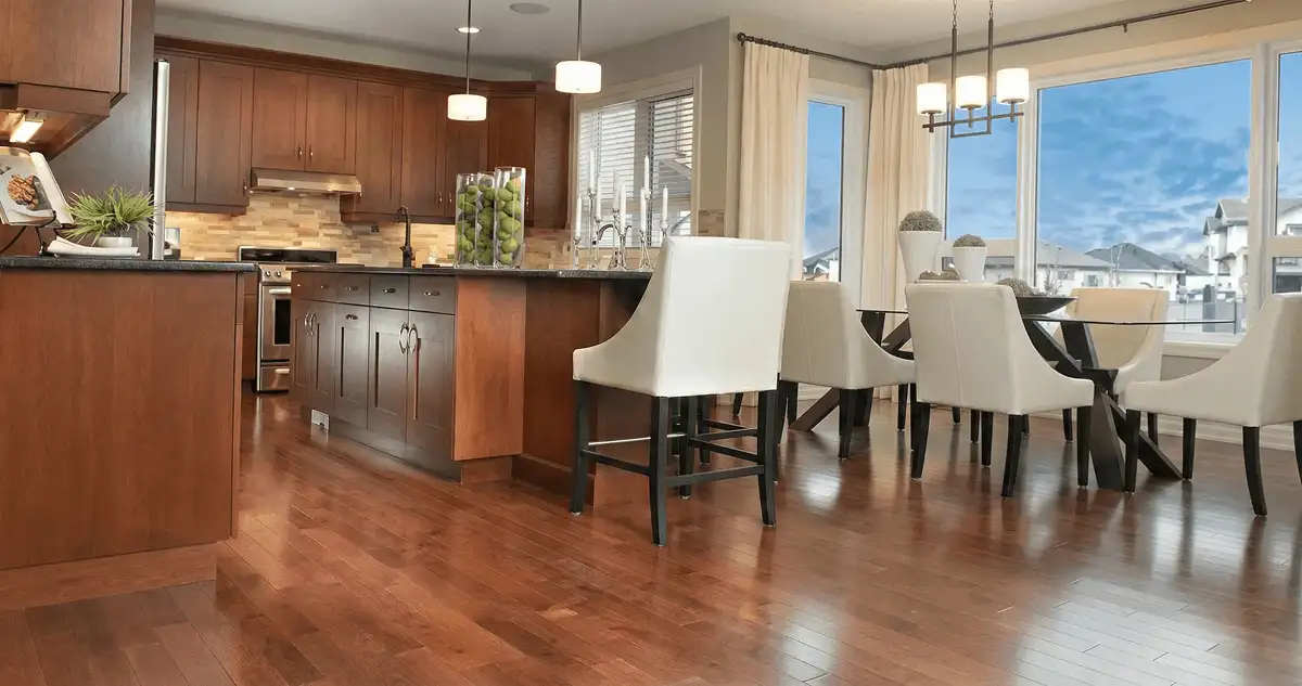 A modern kitchen with professionally installed wood flooring in Rockford, IL