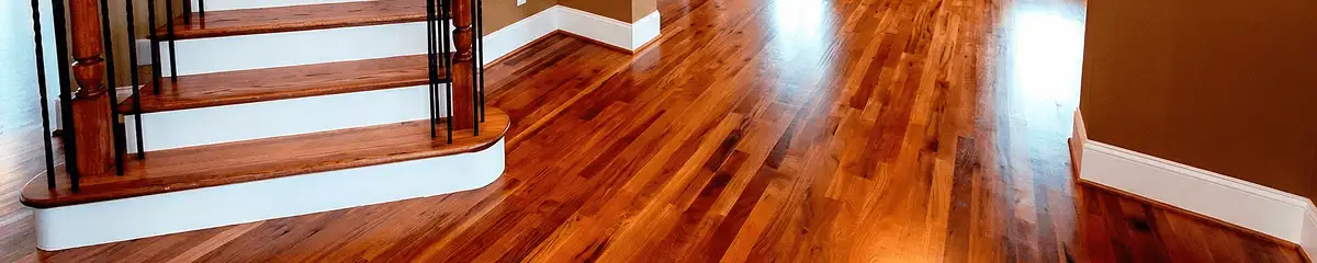 Base floor of a staircase with professionally restored wood flooring in Rockford IL