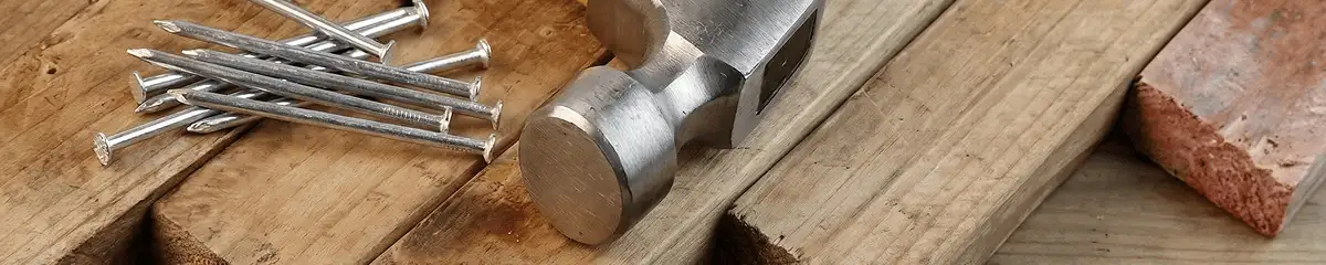 Hammer and nails on hardwood flooring boards in Rockford, IL