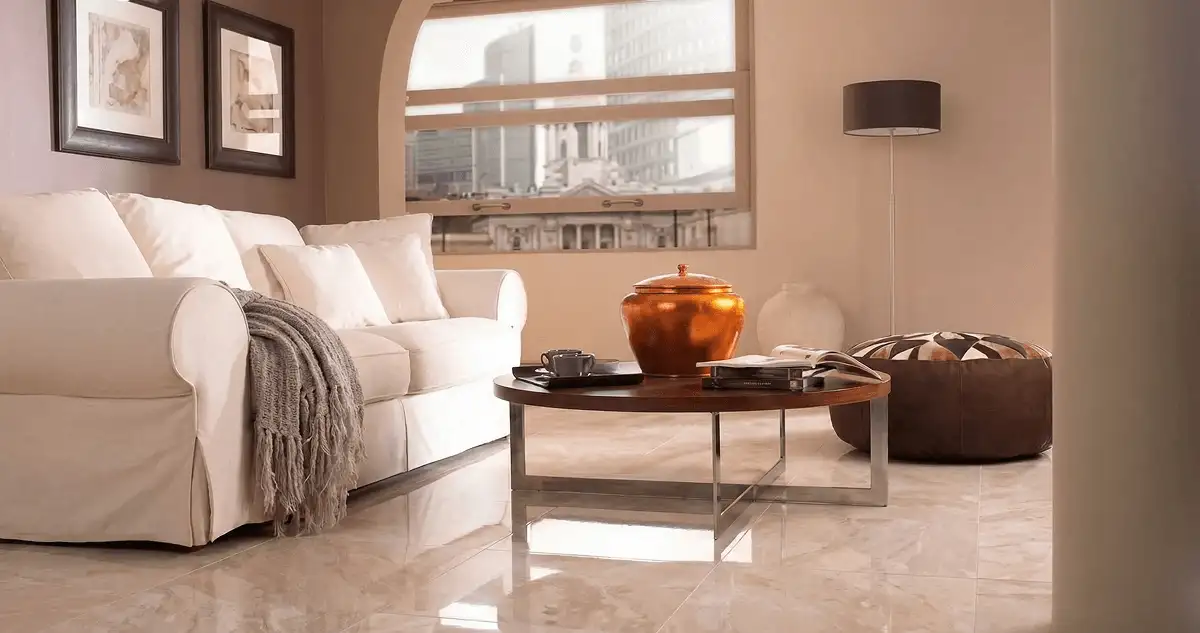 Modern living room with professionally installed marble flooring, a beige sofa, coffee table in Rockford, IL