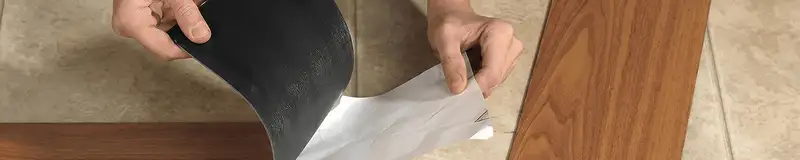 A professional installing vinyl flooring in Rockford, IL
