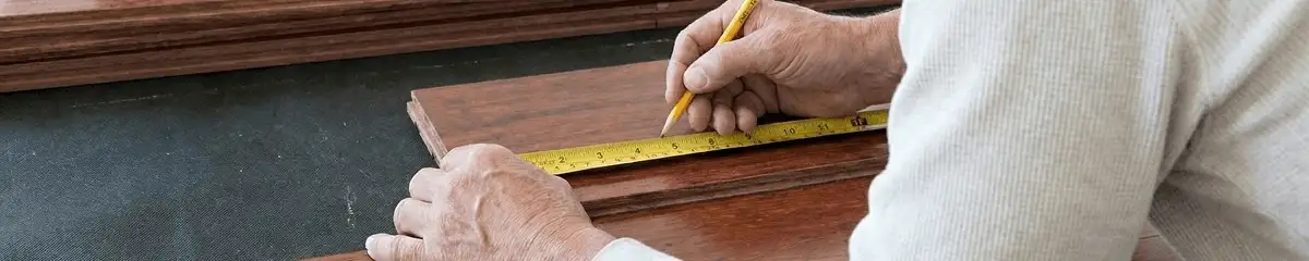 A professional installing wood flooring in Rockford, IL